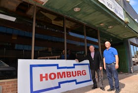 John Cudmore, president of Dyne Holdings Ltd., left, and Gordie Kirkpatrick, the company’s project manager, stand in front of the former Myron’s building in Charlottetown. On Tuesday, Dyne Holding’s chairman, Richard Homburg, confirmed he had purchased the building with plans to open a 105-room hotel in May 2020.