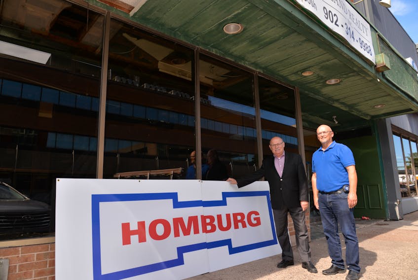 John Cudmore, president of Dyne Holdings Ltd., left, and Gordie Kirkpatrick, the company’s project manager, stand in front of the former Myron’s building in Charlottetown. On Tuesday, Dyne Holding’s chairman, Richard Homburg, confirmed he had purchased the building with plans to open a 105-room hotel in May 2020.