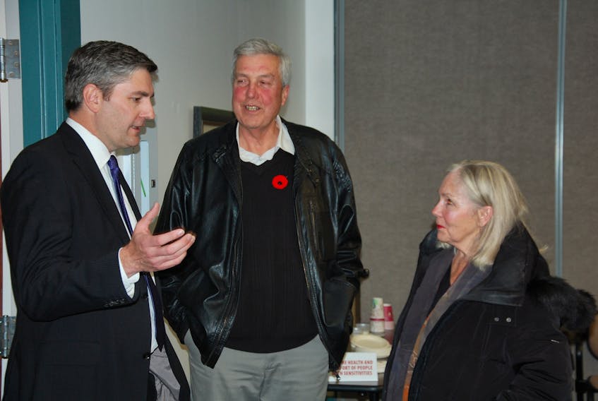 Stratford's new mayor-elect Steve Ogden, centre, speaks with fellow mayoral candidates Jody Jackson, right, and Sandy McMillan at the Town Hall on Monday, Nov. 5, 2018.
