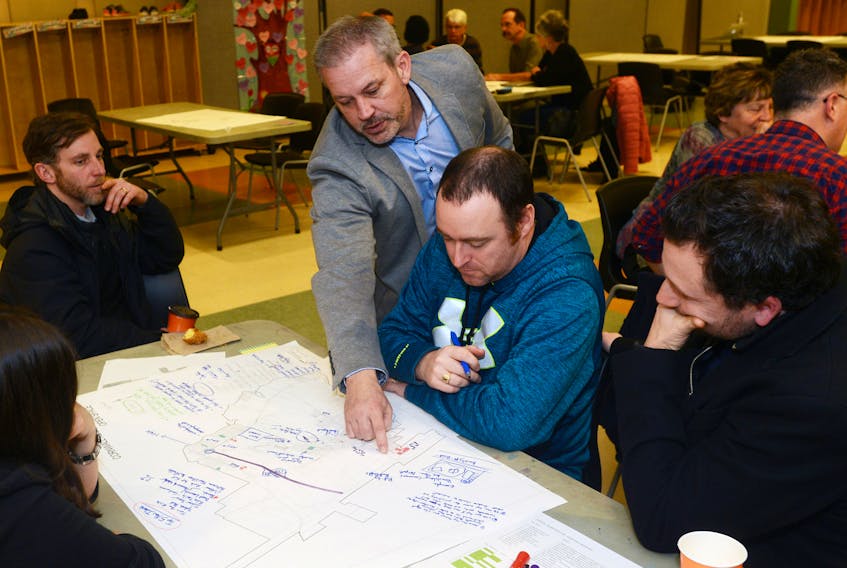 Rob LeBlanc, CEO of Ekistics Plan + Design, points out a spot on the Cornwall map to residents, from left, Baron Delaney, Ryan Casey and Rob MacAdam during a public workshop on the town’s recreational facilities, parks and open spaces Wednesday.