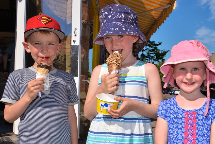 Silas, Kaia and Freya Craik enjoy Cow’s ice cream in Charlottetown on Wednesday.