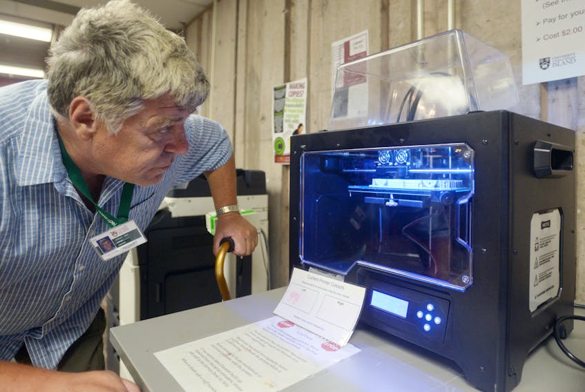 Jean Paul Poirier watches over the 3D printer at Robertson Library as it creates a small model of a Mazda Miata. Poirier can be seen most days at the library creating items with the printer, which he uses as a form of rehab since suffering a stroke last fall.