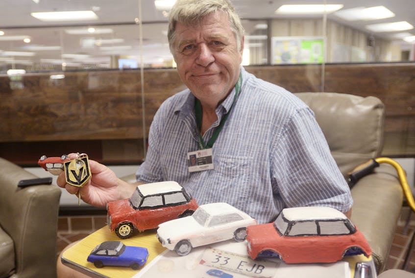 Jean Paul Poirier shows some of the items he’s made from the 3D printer at UPEI’s Robertson Library. While the most common creations he makes are cars, he has also created a keychain of the Vegas Golden Knights logo and doll pieces for his wife.