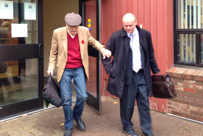 Eric MacEwen, left, leaves the provincial courthouse in Charlottetown with his lawyer, Brendan Hubley, Tuesday, Nov. 6, 2018.