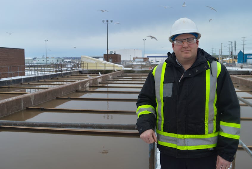Steven Stewart, superintendent of Charlottetown’s wastewater treatment plant, stands in front of the plant’s settling tanks. One of the projects the city has its eye on is increasing the capacity of the plant to handle future wastewater flows.