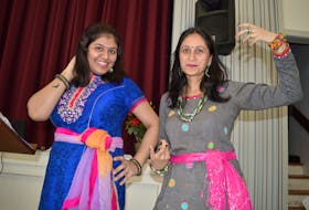 Bollywood dancers Garima Mishra, left, and Rinku Upadhyaya strike a pose prior to the International Women’s Day event held at Trinity United Church in Charlottetown on Thursday. Their performance certainly jazzed up the crowd because everyone joined in.