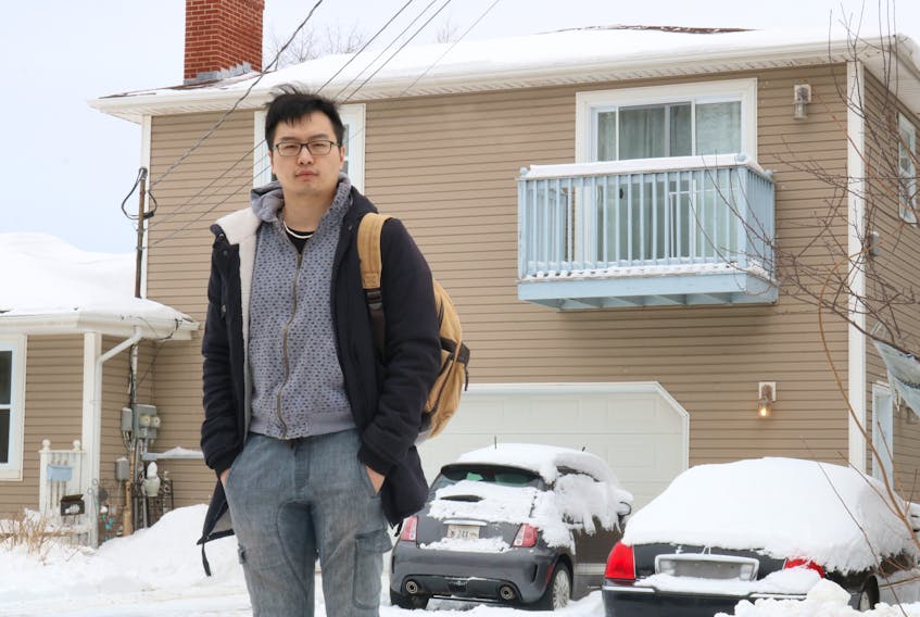 Mengzhou Gong in front of his second-storey apartment in Sherwood. Gong says he is facing eviction from his apartment after he informed his landlord that they could not legally raise his rent more than two per cent.