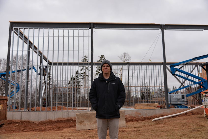 Chad Heron, vice-president of Cows Inc., stands in front of a section of the 40,000 square-foot expansion project. He said the space will be used for more storage and offices.