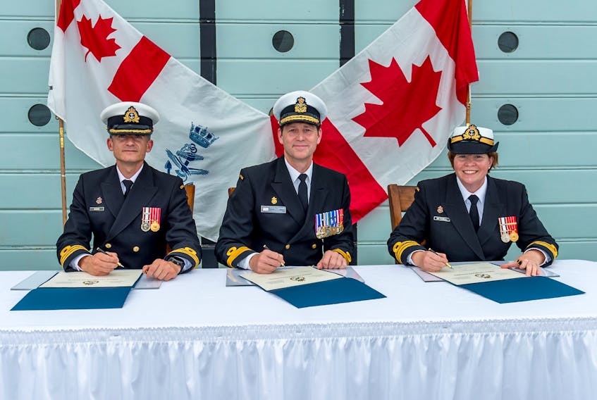 Commander Craig Skjerpen, centre, presides over the change of command ceremony aboard HMCS Charlottetown, during which outgoing Commanding Officer Nathan Decicco is succeeded by Commander Nancy Setchell. Setchell is the second woman to have ever commanded a Canadian frigate since Josée Kurtz helmed HMCS Halifax in 2009.