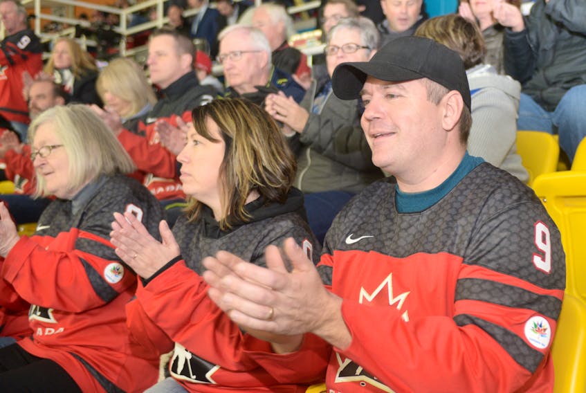 Luke Smith, right, of Monkton, Ont. and his wife, Christine Smith, cheer on Team Canada as players go on the ice for Saturday’s gold medal game against Team USA at MacLauchlan Arena. The two are the parents of Team Canada player Corbyn Smith, who is now in his second year with the team. MITCH MACDONALD/THE GUARDIAN