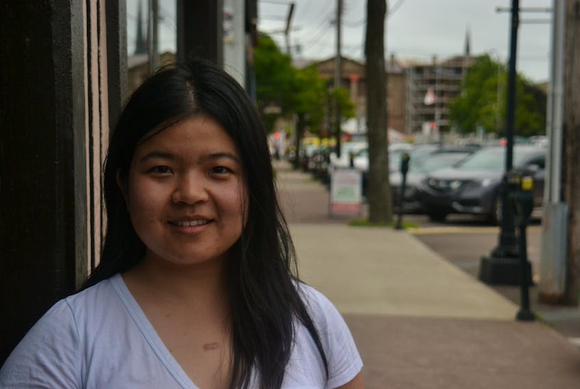 Chelsea Feng graduated from UPEI one year ago. She is struggling with the decision of whether to remain on the Island or return to China.