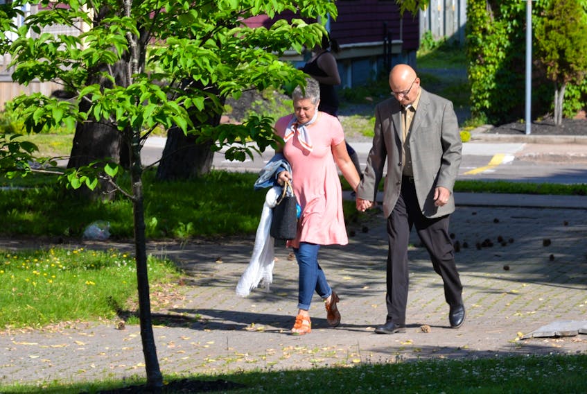 Kim and Roger Jabbour head into the provincial courthouse in Charlottetown on July 10. Roger Jabbour is charged with eight sex-related offences. He has pleaded not guilty to all charges.