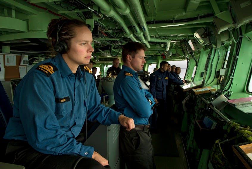 Lieut. (Navy) Teri Share, acting executive officer of HMCS Charlottetown, leads bridge activities recently during a live fire of the 57mm gun during Operation REASSURANCE. Corporal J.W.S. Houck/Special to The Guardian