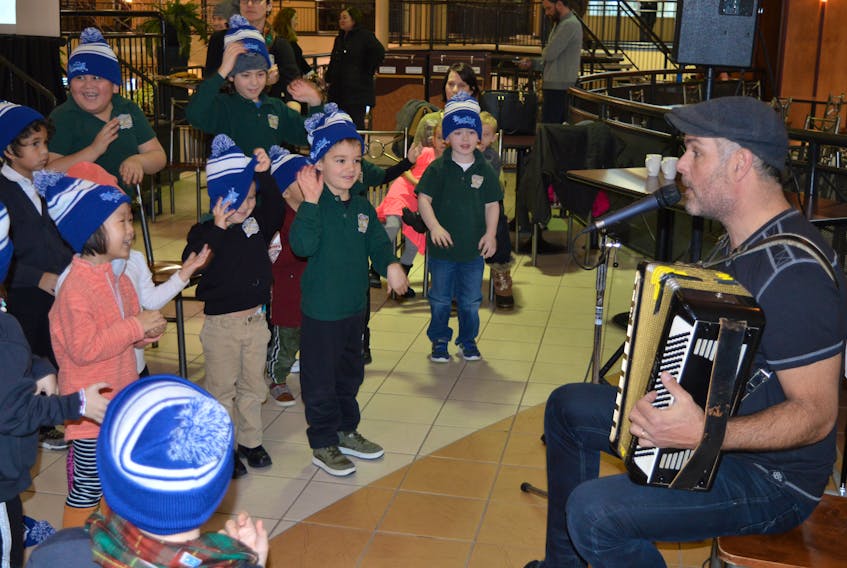 Musician Michael Pendergast entertains children from Montessori School in Charlottetown prior to a news conference Thursday where details around the upcoming Jack Frost Winterfest were announced. Pendergast will also be involved in the festival, entertaining children at the pancake breakfast on Saturday, Feb. 17 from 8-10 a.m. at Confederation Court Mall.