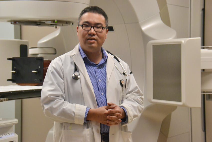 Dr. Larry Pan, radiation oncologist at the P.E.I. Cancer Treatment Centre, provides a demonstration of the new $10 million TrueBeam linear accelerator. The TrueBeam will provide more precise radiation treatment and will allow doctors to treat smaller tumours earlier, helping patients avoid some surgeries.