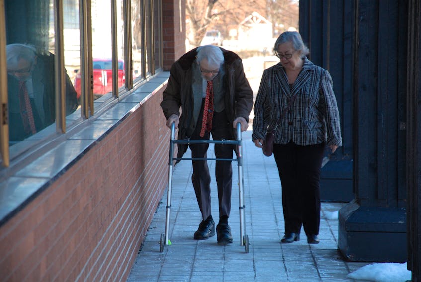 Jim Munves, 96, of Charlottetown makes his way to the Supreme Court of P.E.I. with Ann Sherman Wednesday morning in a fight to have his wife, Barbara, released from a nursing home and into his care. Munves later came to an agreement with the province to bring her back home, although some details of Barbara’s return have yet to be determined.