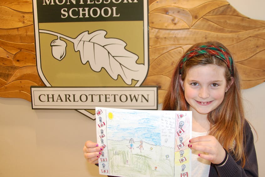 Julia Fitzgerald, a Grade 4 Montessori student, holds up her winning entry that has earned her a trip to the "Imagine a Canada" national arts and leadership initiative in Winnipeg.