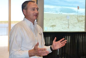 Chris Houser, dean of science at the University of Windsor, talks about the hazards of rip currents during a presentation at the Delta Prince Edward on Saturday.