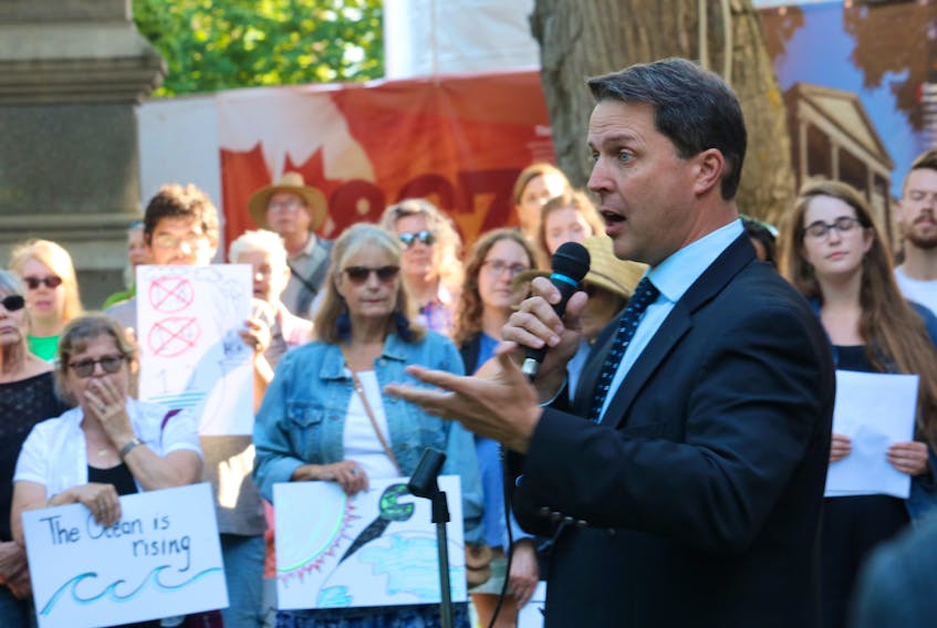 P.E.I. Environment Minister Brad Trivers addresses a crowd at a rally for climate targets Tuesday, July 9, 2019, in Charlottetown.