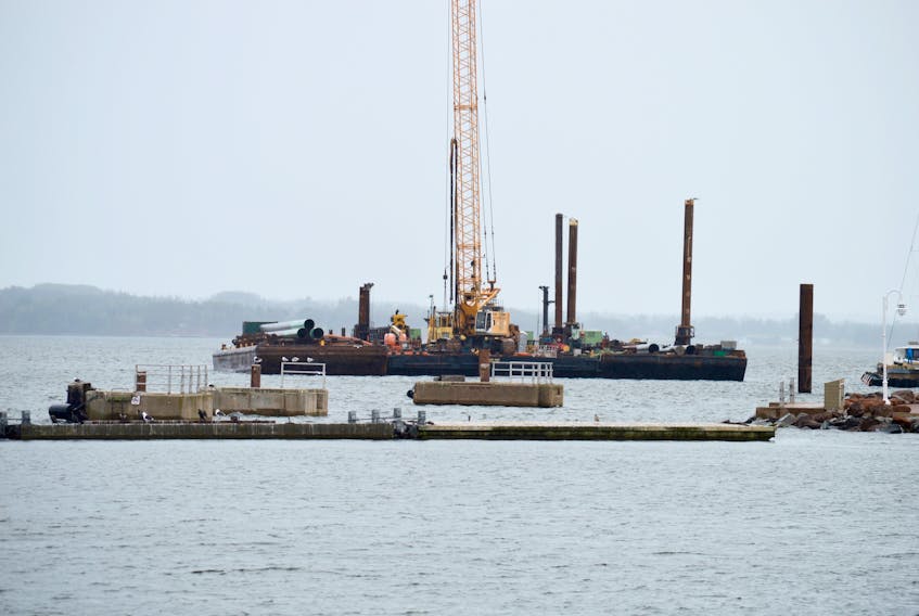 A large crane works in the Charlottetown Harbour on Tuesday as the $12 million Port Charlottetown expansion project ramps up. When work is done, two cruise ships measuring 330 metres can berth simultaneously.