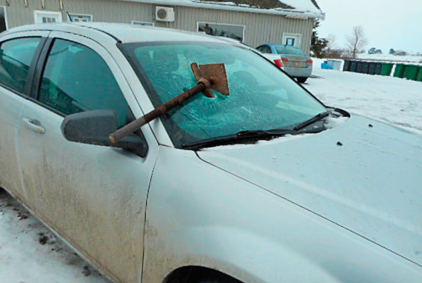 The RCMP provided this image along with a note asking Islanders to help them identify who did this. The damaged vehicle had been parked at Sherbrooke Mechanical just outside of Summerside.  ©THE GUARDIAN
