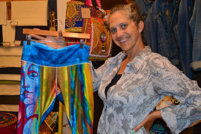 Angie MacDonald, co-owner of eco*spirit in the Confederation Court Mall in Charlottetown, displays a pair of pants made from 100 per cent recycled plastic bottles.