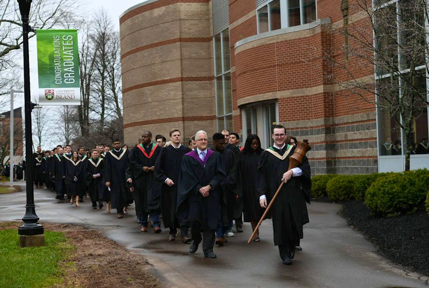 Mace-bearer Will McGuigan leads his classmates to the Saturday morning convocation ceremony at UPEI. McGuigan, who received his diploma for bachelor of business administration, served as president of the UPEI student union.