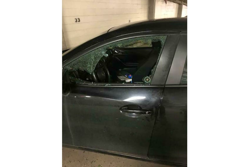 The driver's-side window to Mark Leard’s 2015 Mazda 3 was smashed on Sunday during the Remembrance Day ceremony in Charlottetown.