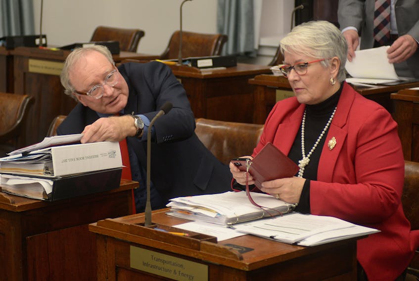 P.E.I. Premier Wade MacLauchlan and Liberal MLA Paula Biggar are shown in the legislature Wednesday.
