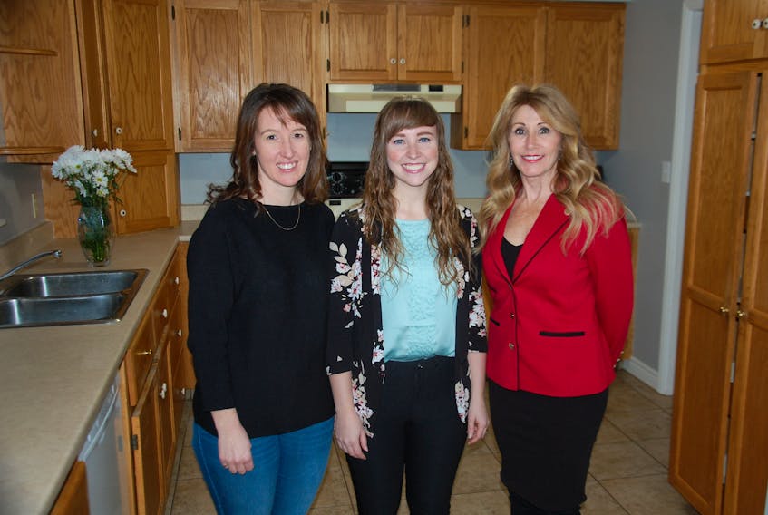 Family and Human Services Minister Tina Mundy, right, has praises Blooming House co-founders Brynn Devine, left, and Liz Corney for filling a void by opening a women’s shelter in Charlottetown. The province announced Monday $60,000 in funding support for the initiative.