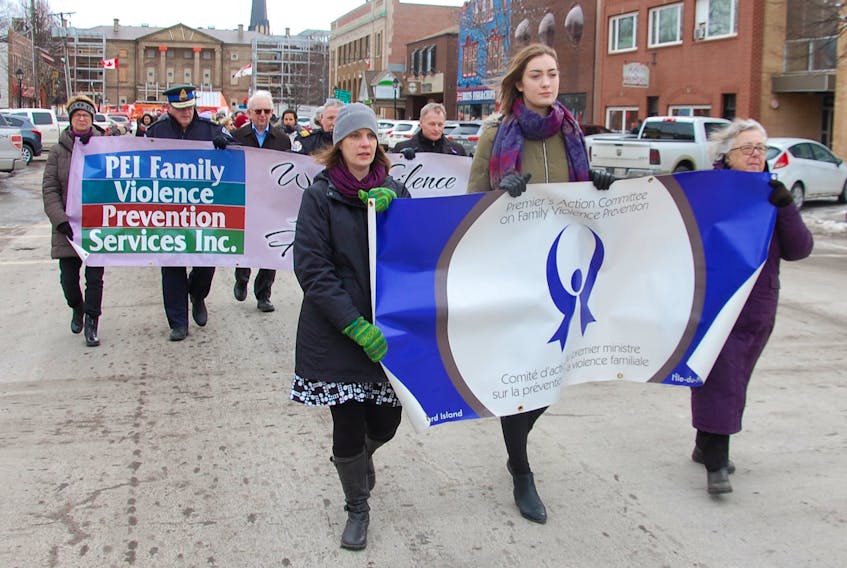 Leading the charge in Charlottetown Wednesday in the Walk in Silence for Victims of Family Violence are Family Violence Prevention Services executive director Danya O’Malley, left, UPEI student and survivor of violence Taya Nabuurs and Ann Sherman, chairwoman of the Premier’s Action Committee on Family Violence Prevention.