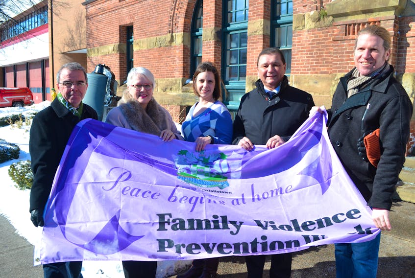 Taking part in activities marking Family Violence Prevention Week in Charlottetown are, from left, Mayor Richard Brown, Status of Women Minister Paula Biggar, Danya O'Malley, co-chair Family Violence Prevention Week, Sen. Brian Francis and Ian Forgeron, co-chair Family Violence Prevention Week.
