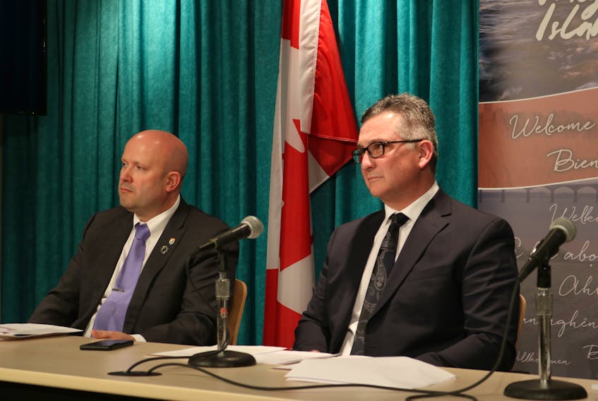 Deputy finance minister Neil Stewart, left, and Finance Minister Heath MacDonald deliver the province’s latest fiscal update. The province is projecting a $13.8 million surplus.