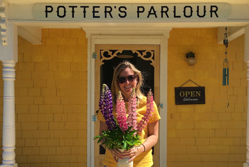 Suzanne Scott stands outside her new business venture Potter’s Parlour in New London.