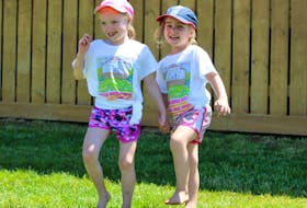 Piper Bjorklund, 6, and her cousin Emerson MacPhee, 4, got their feet moving at the 2018 Rollo Bay Fiddle Festival held on the weekend.