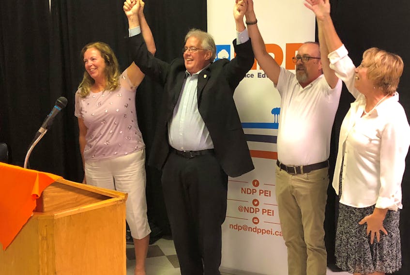 Leah-Jane Hayward, left, P.E.I. NDP Leader Joe Byrne, Gordon Gay and Lynne Thiele celebrate at a recent gathering in Charlottetown where the other three joined Byrne as nominated candidates for the NDP in the next Prince Edward Island provincial election.