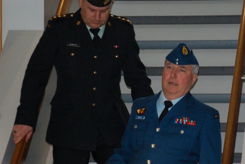 Capt. Todd Bannister, left, and his defence lawyer Maj. J.L.P.L. Boutin make their way to the courtroom Tuesday as the second day of Bannister's court martial trial got off to a late start close to 2 p.m. Bannister faces three charges of behaving in a disgraceful manner and three charges of conduct to the prejudice of good order and discipline following alleged misconduct while serving as the army cadet commander in Charlottetown.  ©THE GURADIAN - Jim Day