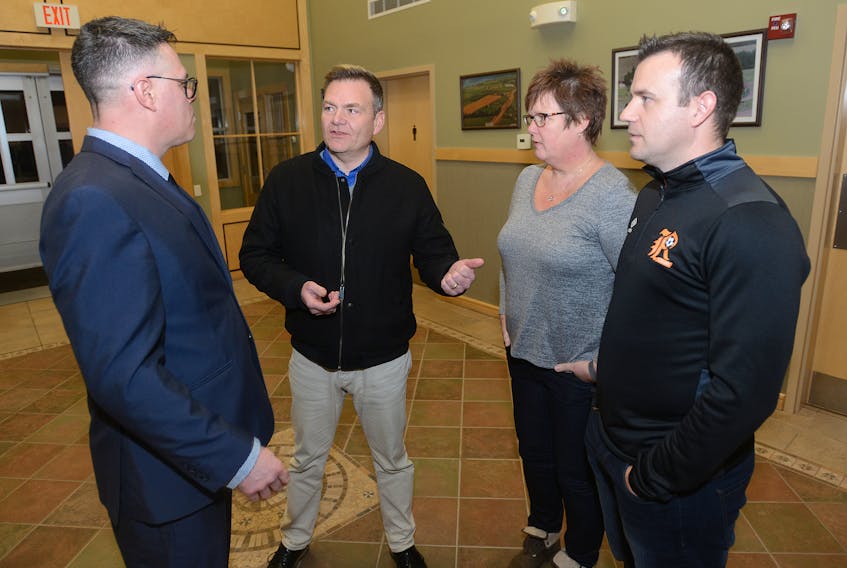 Ramblers Soccer Club president Jonathan Gauthier, from right, treasurer Antoinette Goeseels and representative Scott Crawford speak with Cornwall Coun. Corey Frizzell following Wednesday’s meeting. Council voted to freeze its recreational facility fees for the next year while council looks at ways to promote more activity among residents.