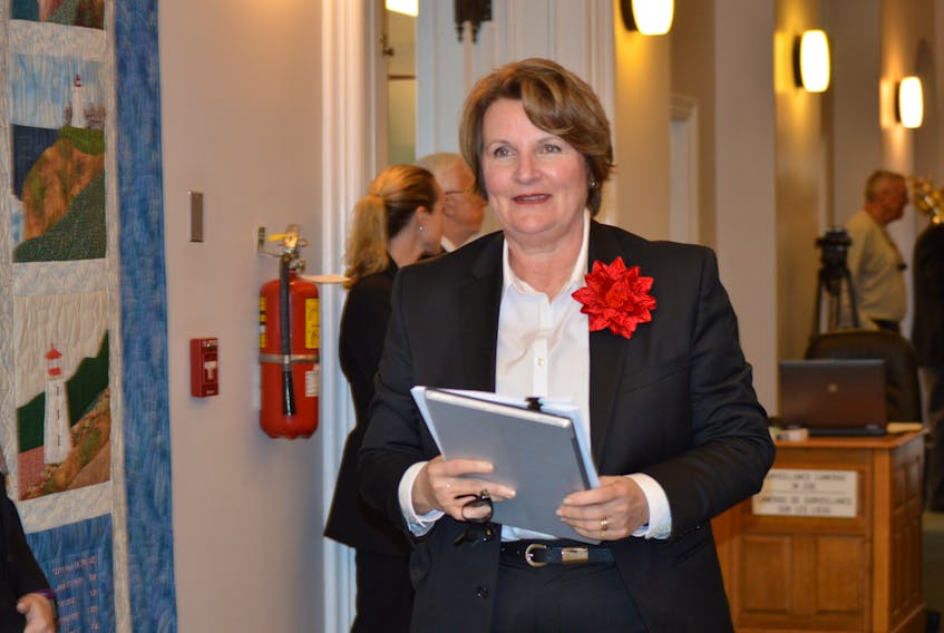 PC MLA Darlene Compton enter the provincial legislature on Thursday, Nov. 16, 2017.