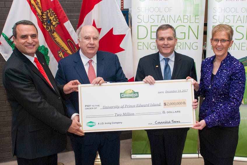 UPEI president Alaa Abd-El-Aziz, left, joins Robert K. Irving, president of Cavendish Farms; Ron Clow, general manager of Cavendish Farms; and Myrtle Jenkins-Smith, executive director of UPEI Development and Alumni Engagement, at a cheque presentation supporting the university’s engineering school.