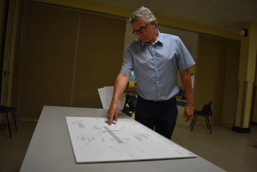 Bridge engineer Neil Lawless who works with the province of P.E.I. points to a diagram which shows where the construction will happen to replace the Head of Montague Bridge at a public information session at the Cavendish Farms Wellness Centre.