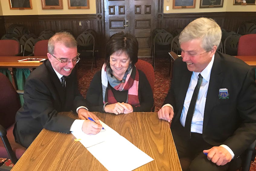 Charlottetown Mayor Philip Brown, left, speaks with Cornwall Mayor Minerva McCourt and Stratford Mayor Steve Ogden at Charlottetown City Hall during the first tri-municipal meeting of 2019 to discuss potential opportunities for co-operation and shared services.