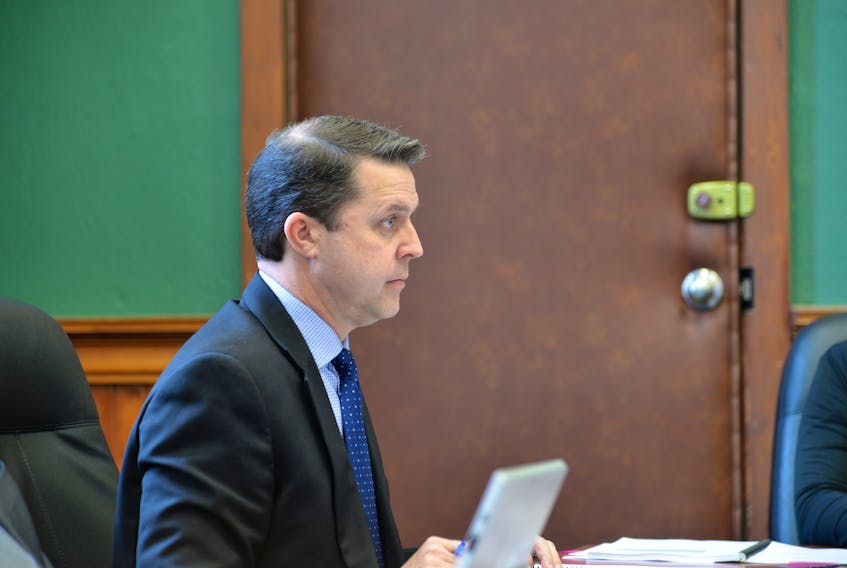 PC MLA Brad Trivers, chair of the public accounts committee, listens during the committee meeting on Wednesday.