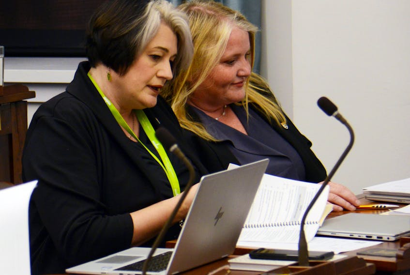 Green MLAs Michele Beaton, right, and Hannah Bell chat prior to the legislature session last week.