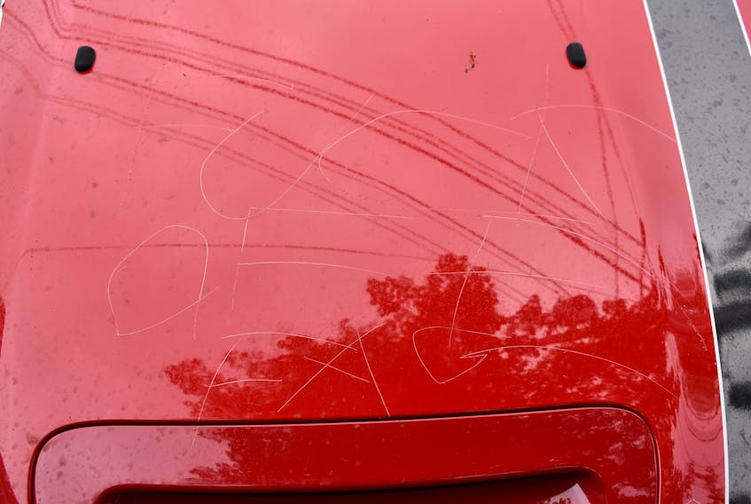 A homophobic slur was scratched into the hood of D.J. McCulloch's Mini Cooper while it was parked in a Charlottetown parking lot Thursday, Aug. 16, 2018.