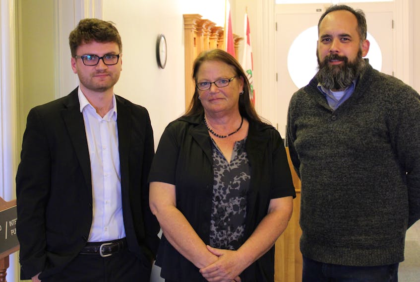 Native Council of P.E.I. policy analyst Matthew MacDonald, from left, president Lisa Cooper and Jonathan Hamel pose for a photo in the Coles Building following their presentation to the Standing Committee on Health and Wellness.