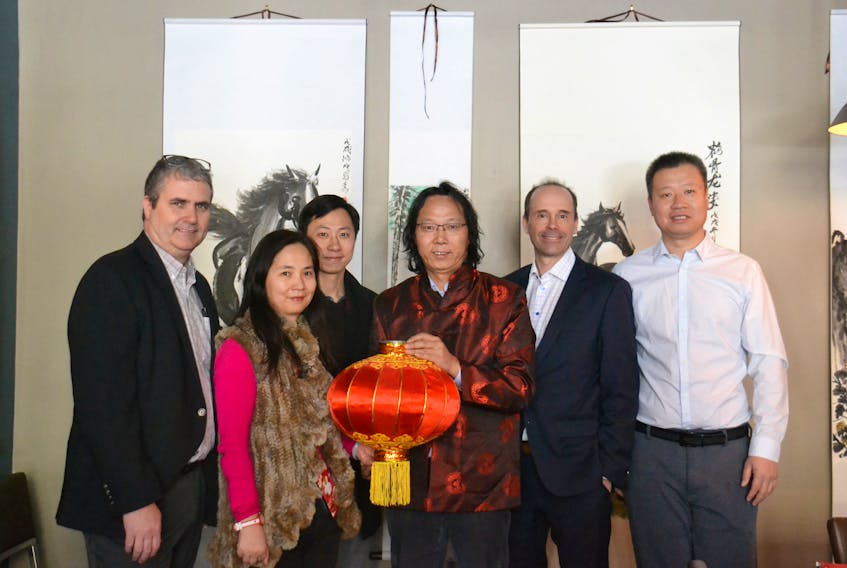 Paul Yin, president of the Canadian Chinese Association of Prince Edward Island, centre, holds a lantern as he welcomes guests to the 2019 Lantern Festival reception in Charlottetown on Tuesday. Over 100 people attended the event at the Row House Steak and Lobster restaurant, which was hosted by seven P.E.I. firms. From left are Phil Muise, Exit Realty, Ally Guo, Gigigu, Frank Chen, McInnes Cooper, Gary Scales, McInnes Cooper and Richard (Yuehe) Yu, businessman.