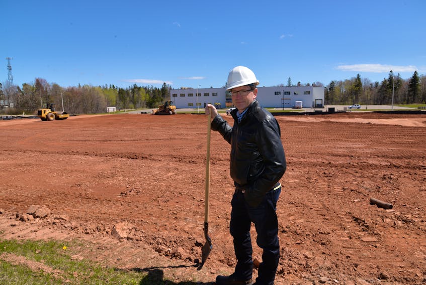 Edwin Jewell, president of Canada’s Island Garden, stands in front of the company’s $35-million expansion project on Friday in the BioCommons Research Park.