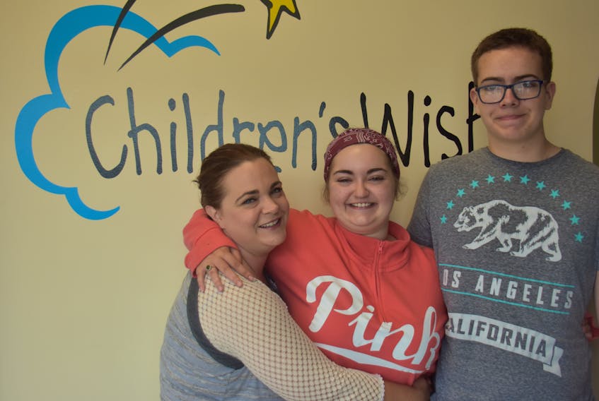 Haley Matheson (centre) poses with her mother Marion McPhee (left) and brother Reece Matheson at the Children’s Wish Foundation in Charlottetown P.E.I. July 18.
