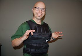 Dr. Vincent Adams, a long-time P.E.I. chiropractor, strapped on his 50-pound vest Tuesday morning to wear until he raises $5,000 for Lennon House, a client centered recovery home.